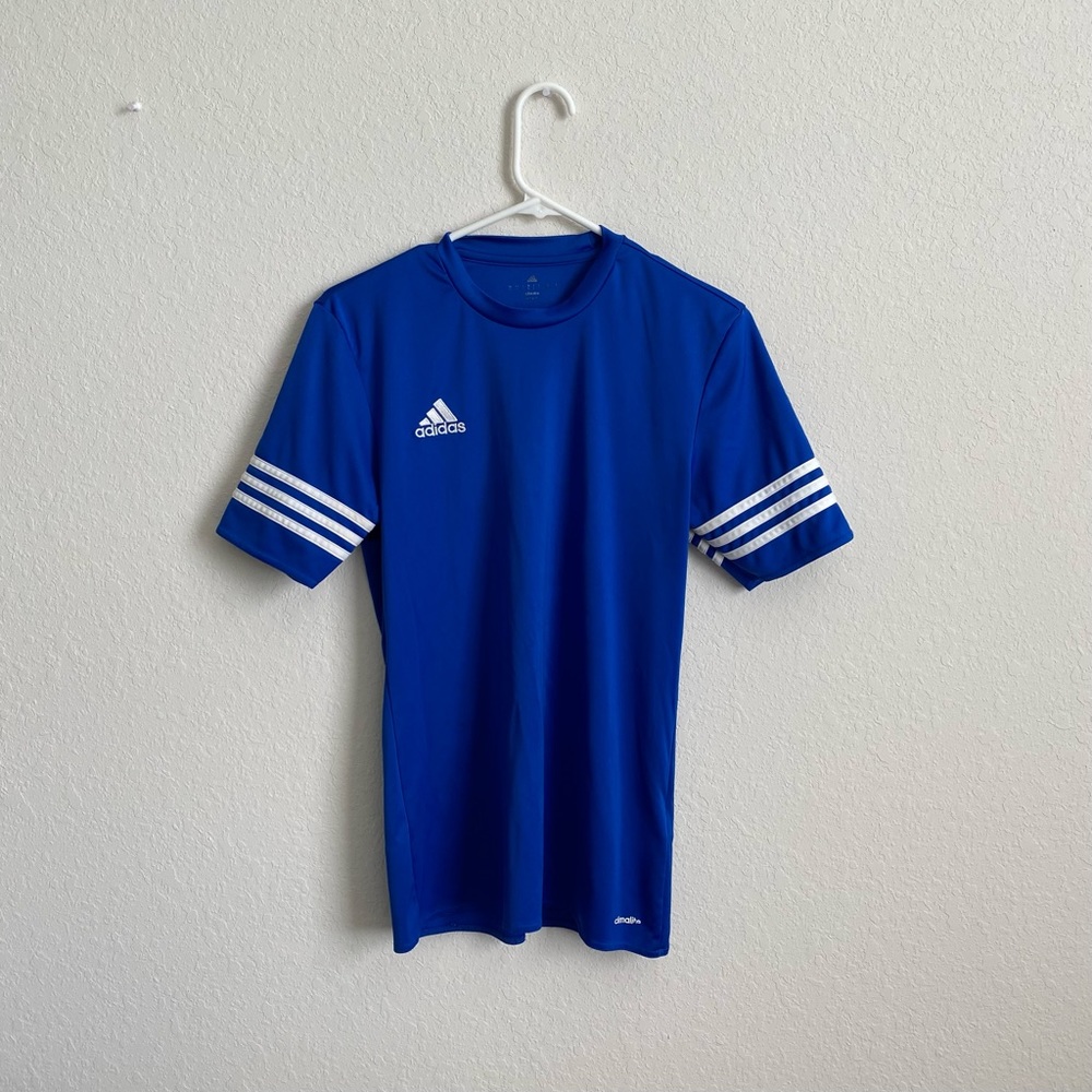 Adidas woman’s polyester climalite top, with embroidered logo on top right.